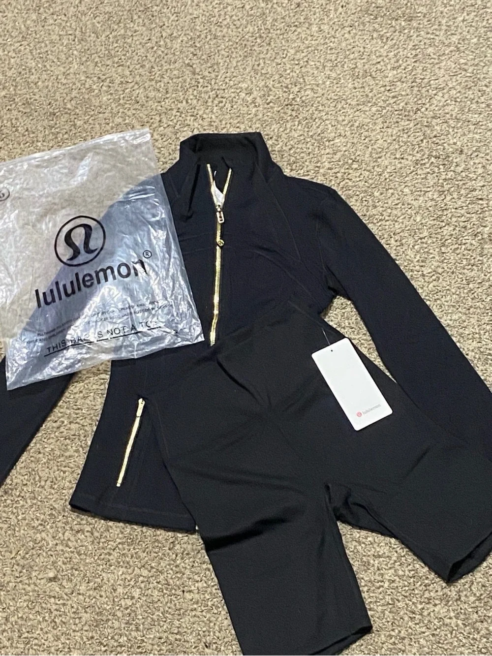 lululemon athletica Black Long-Sleeve Romper with Gold Zippers